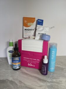 Flat lay of hormonal acne skincare routine products