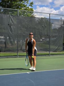 Woman in a tennis dress on the court