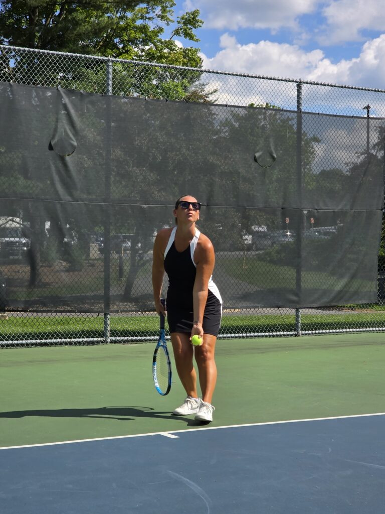 Woman in a tennis dress on the court