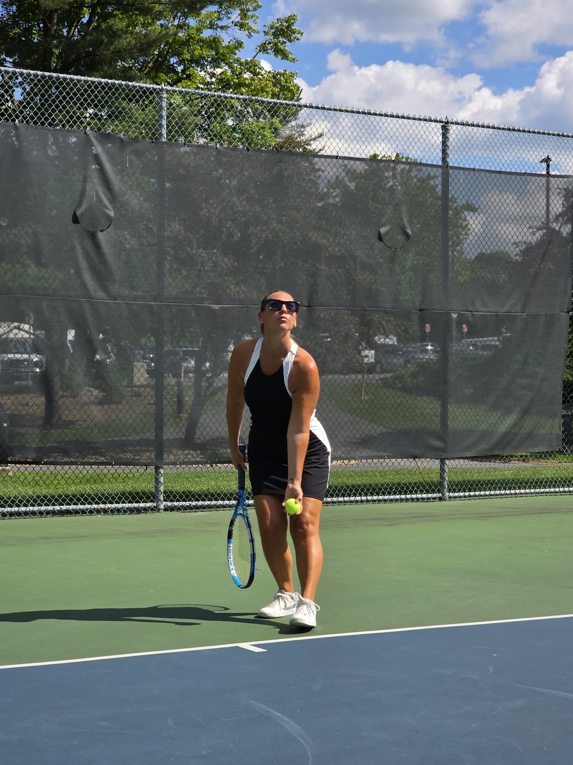 Woman in a tennis dress on the court
