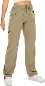 Olive green drawstring cargo pants styled with white sneakers