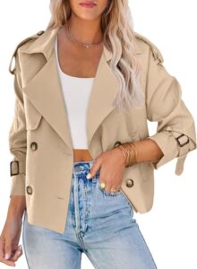 Camel cropped trench jacket worn over a white top and jeans