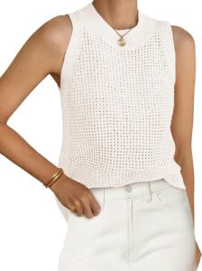 Cream open-knit sleeveless sweater styled with white jeans